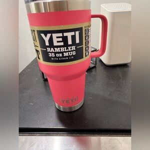 Pink color 35oz Yeti travel mug with straw lid